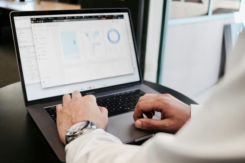 Professional reviewing debt portfolios on Debexpert marketplace