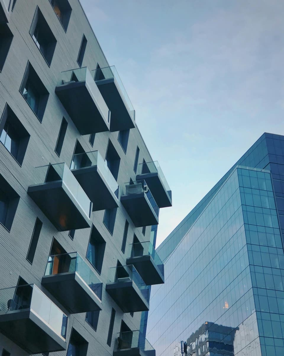 Modern residential and high-rise buildings — real estate collateral for mortgage notes