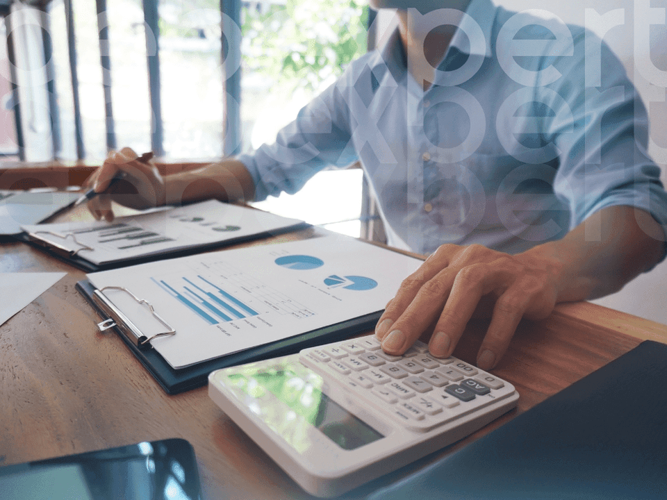 64a55f8695fca0e19540eb2b_The-man-calculates-a-mortgage-on-a-calculator.png