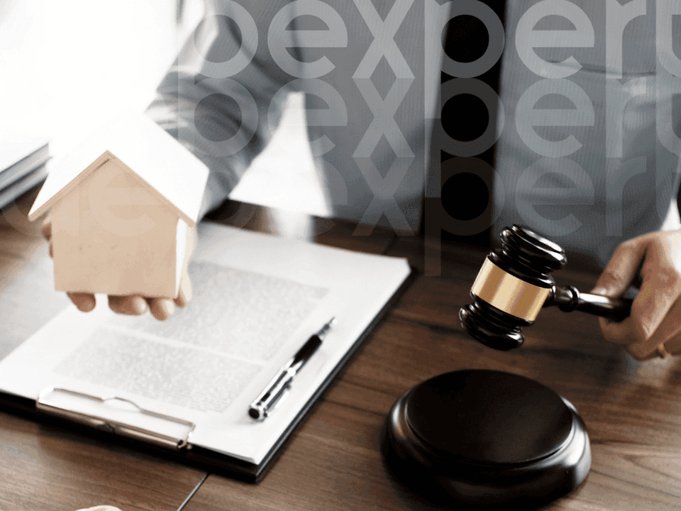 6527871291b27b545cf4b0c5_A-man-holds-a-judge-s-hammer-and-a-toy-house.png